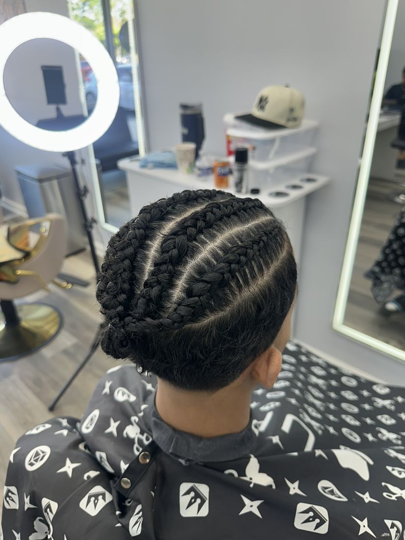 Cornrow braids styled at Paula's Hair Salon