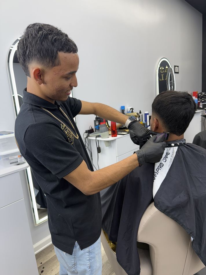 Barber detailing a fresh cut