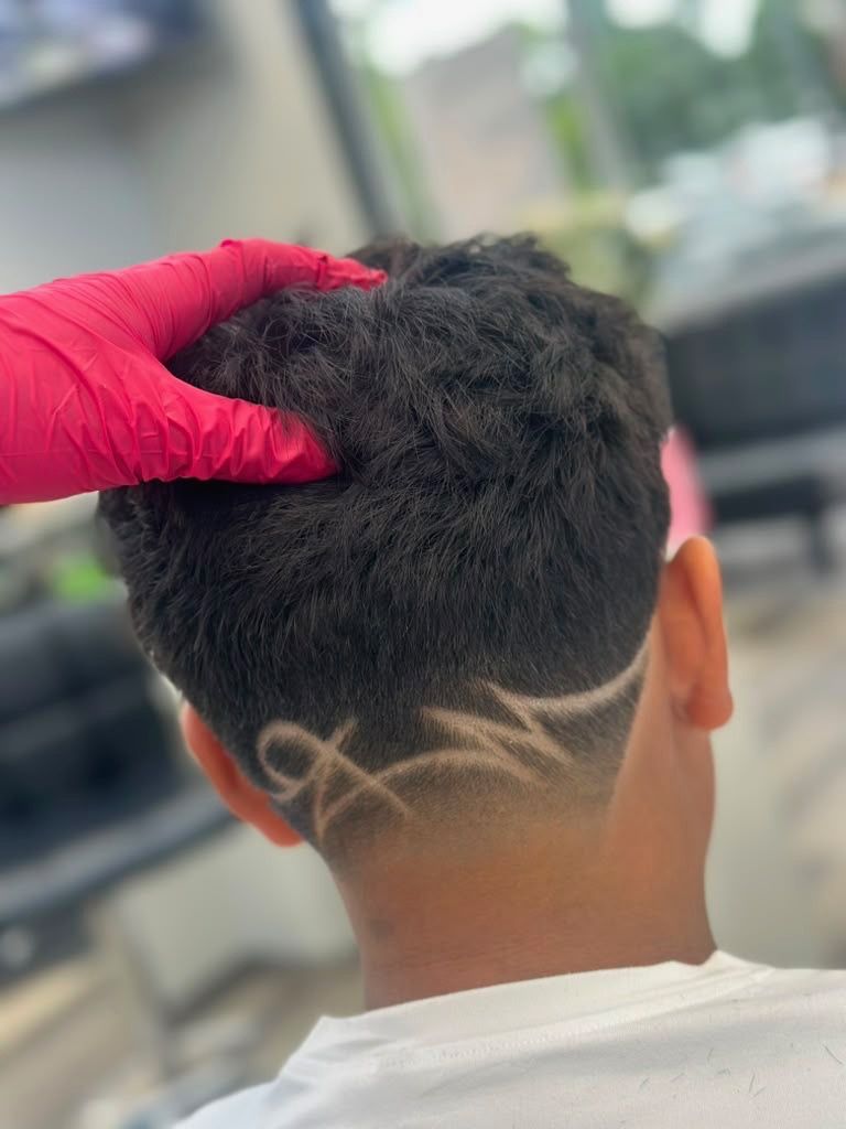 Freestyle hair design detail on a men's cut