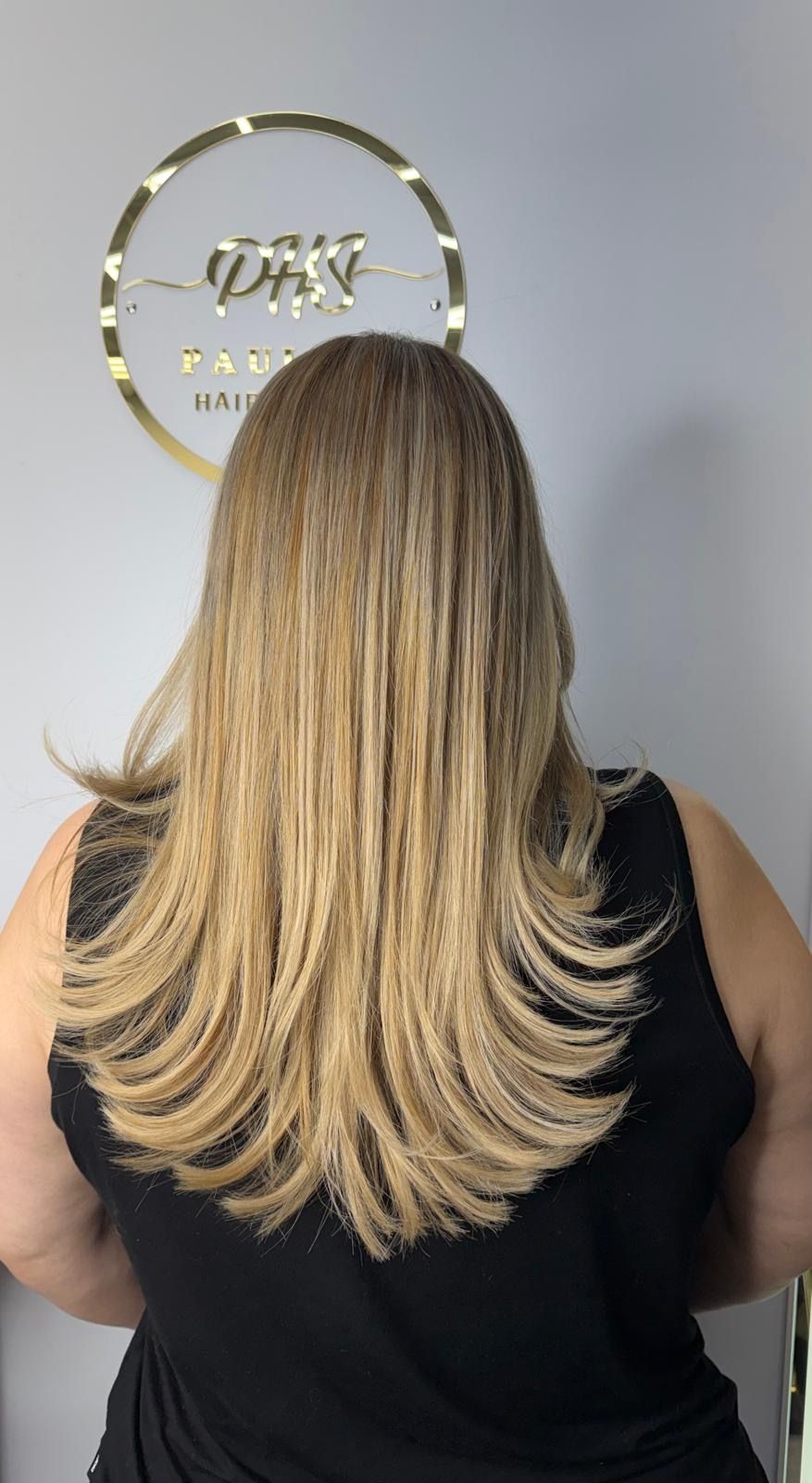 Blonde balayage with layered blowout